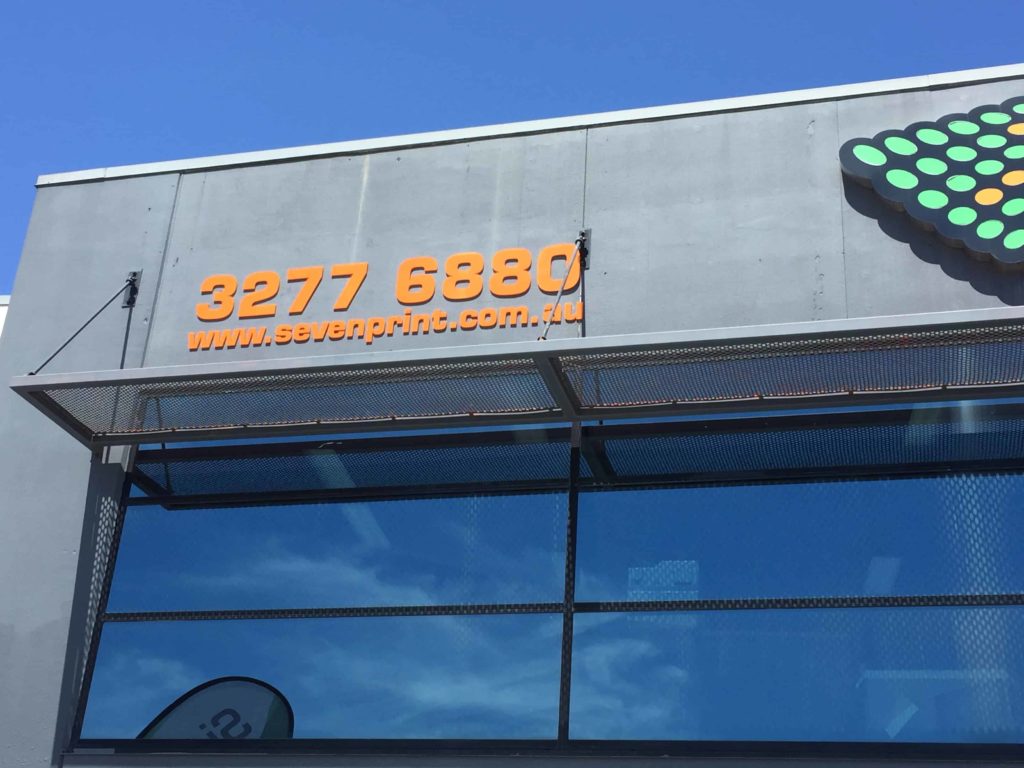 3D letter sign in a shop setting with the letters in a sleek 3D design.